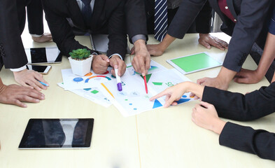 Business People Analyzing Statistics Financial Concept or Business People Meeting Conference Discussion Corporate Concept or Teamwork with business people analysis cost graph on desk at meeting room.