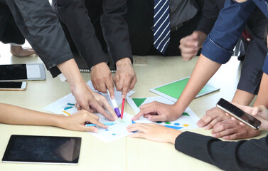 Business People Analyzing Statistics Financial Concept or Business People Meeting Conference Discussion Corporate Concept or Teamwork with business people analysis cost graph on desk at meeting room.