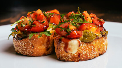 Close-up view of tomato and mozzarella bruschetta on white background. Healthy life concept.