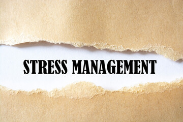 STRESS MANAGEMENT message written under torn paper. Business, technology, internet concept.