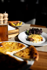 National pastries Ossetian pies with different fillings, cheese, meat, herbs, potatoes 