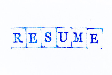 Blue color ink rubber stamp in word resume on white paper background