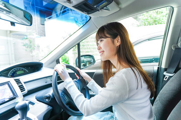 Young woman driving a car