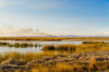 Lake Titicaca is a lake between Peru and Bolivia. It is the highest lake in the world available for transportation.