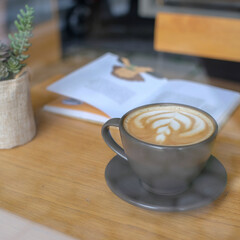 cup of coffee on wooden table