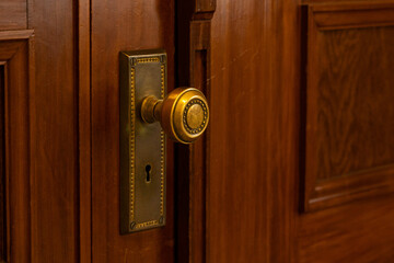 brass handle of old wood door.