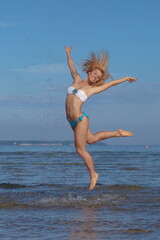 Woman with sporty body in bikini