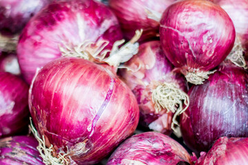 Fresh red onions on a market