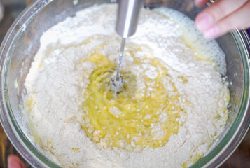 Blurry, out of focus of Mixing Batter or dough for cake or muffin or pancake.