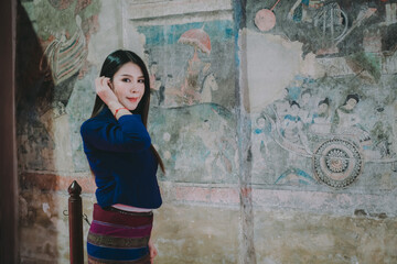 A woman wearing a traditional dress of northern Thailand.