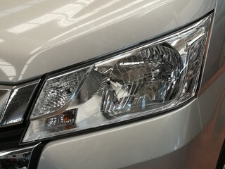 Headlight lamp of new van,Close up detail on one of the LED headlights modern van.