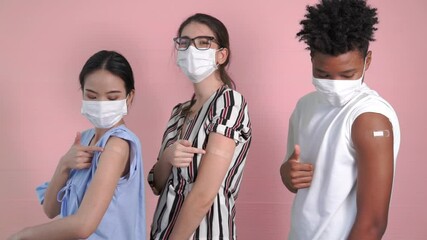 Diverse group of people showing COVID-19 vaccine bandage merrily in concept of coronavirus vaccination program to vaccinate citizen . - Powered by Adobe