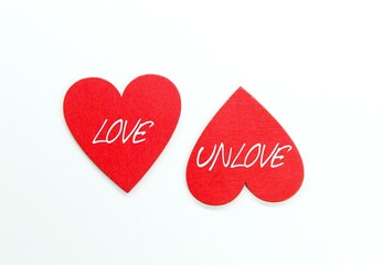 two heart forms with the words love and unlove