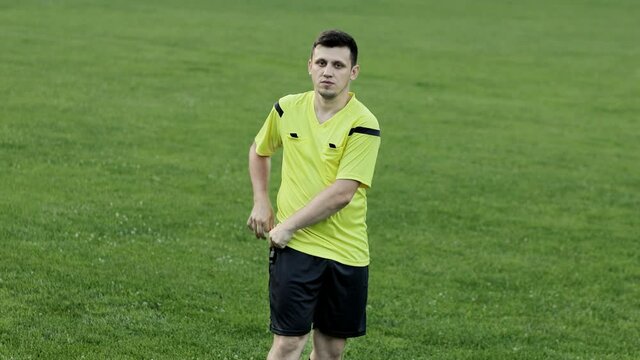 Soccer referee shows yellow card . Concept of sport, rules violation, offside.