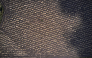 Shot of the field from drone. Farmers field. Road between fields. Background or texture