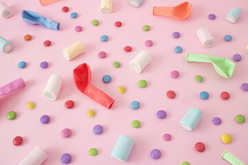 Halloween balloon, marshmallow and candy pattern on pastel pink background. Sweet junk food concept. Flat lay..
