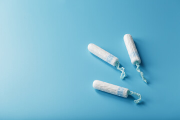 Gynecological tampons on a blue background free space