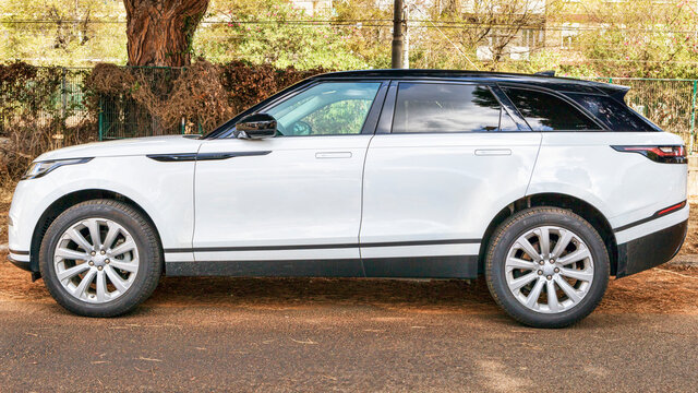 Profile view of beautiful white suv car model Range Rover Velar D240 S from Land Rover automaker