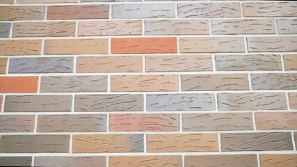 Brickwork from multi colored bricks texture of the wall design of the facade and interior in loft...