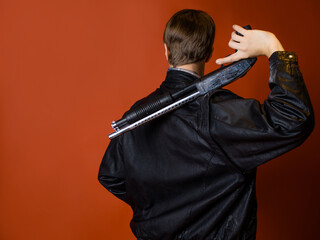 fighter for justice, a guy in a casual shirt and a leather jacket with a shotgun