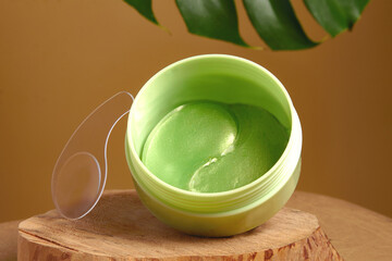 green eye patches to reduce puffiness and bruising under the eyes.   the concept of self-care