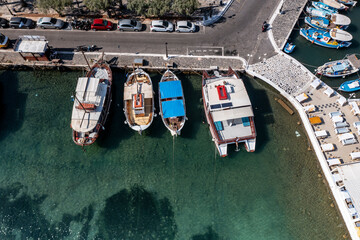 Fototapeta na wymiar panoramic view of the sea and mountains and ships on turquoise water filmed from a drone