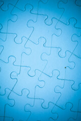 Fototapeta premium Blue Jigsaw puzzle background.