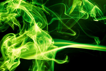 Green smoke on black background.