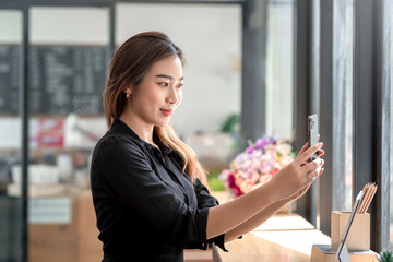 Young Asian woman taking a selfie face at the office.