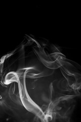 White smoke on black background.