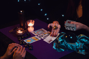 Cards, crystal ball and candles in a tarot session - obrazy, fototapety, plakaty