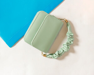 Pastel green women's bag creates an elegant impression. Very suitable to be used to attend formal events or to hang out with friends and family. A bag with a simple design. Bag mockup.