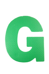 Alphabet foam colorful puzzle pieces on white background.