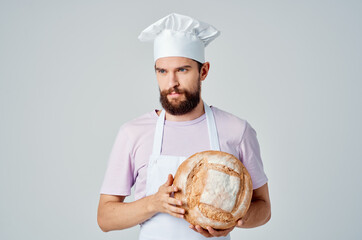 bearded man in apron cooking food preparation restaurant