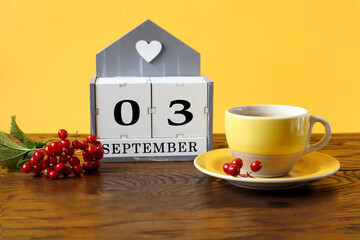 Calendar for September 3 : the name of the month in English, cubes with the numbers 0 and 3, a...