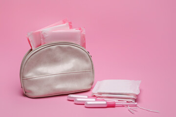 Bag, menstrual pads and tampons on pink background - obrazy, fototapety, plakaty