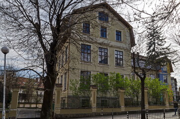 Fototapeta na wymiar View of the beautiful old building of Vasil Aprilov school in the center of the capital in the spring, Sofia, Bulgaria