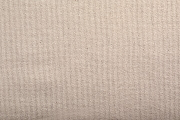 Fototapeta premium Beige hemp cloth as background, top view. Natural fabric