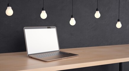 Minimalist workplace. Laptop on wooden table and gray background. 