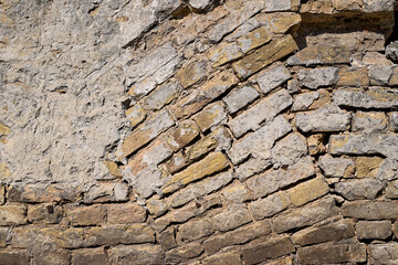 Wall texture.. Antique brick wall with chaotic masonry.