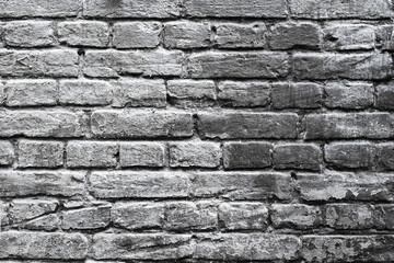 Wall texture.. Old black and white brick wall close up.