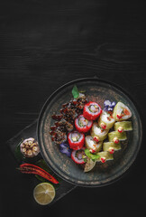 sushi roll in plate on black wooden table background