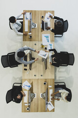 Group of business people working together in modern office,m taken from top view high angle.