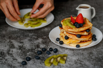 Woman preparing pancakes