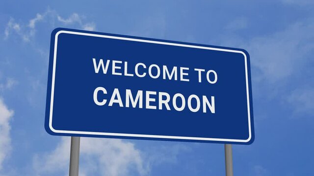 Welcome to Cameroon Road Sign on Clear Blue Sky with Rapid Moving Clouds