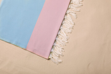 Fototapeta na wymiar Soft beach towel on sand, top view