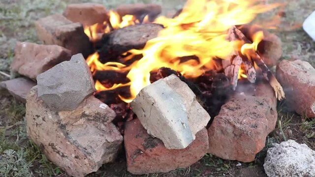 Meal on campfire, potatoes ib bonfire, close up