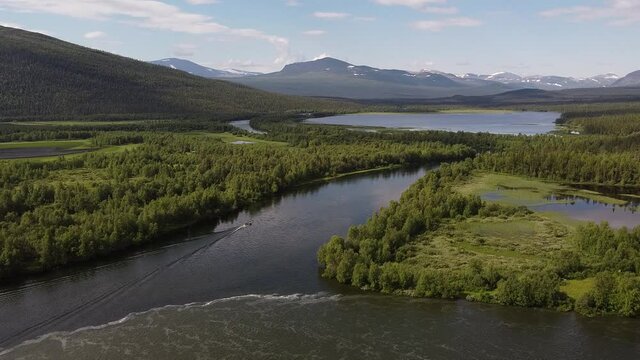 Drone footage of the river valley near STF Mountain Station, Kvikkjokk,  Lapland, Sweden