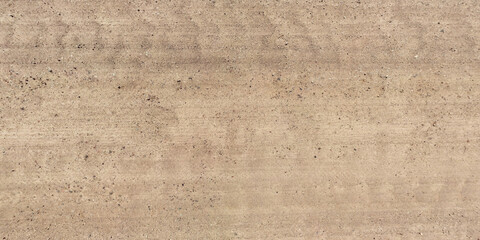 panorama view from above on surface of gravel road with car tire tracks