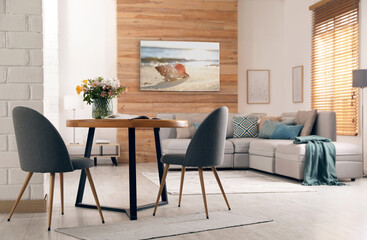 Fototapeta na wymiar Modern wide screen TV on wall in room with stylish furniture